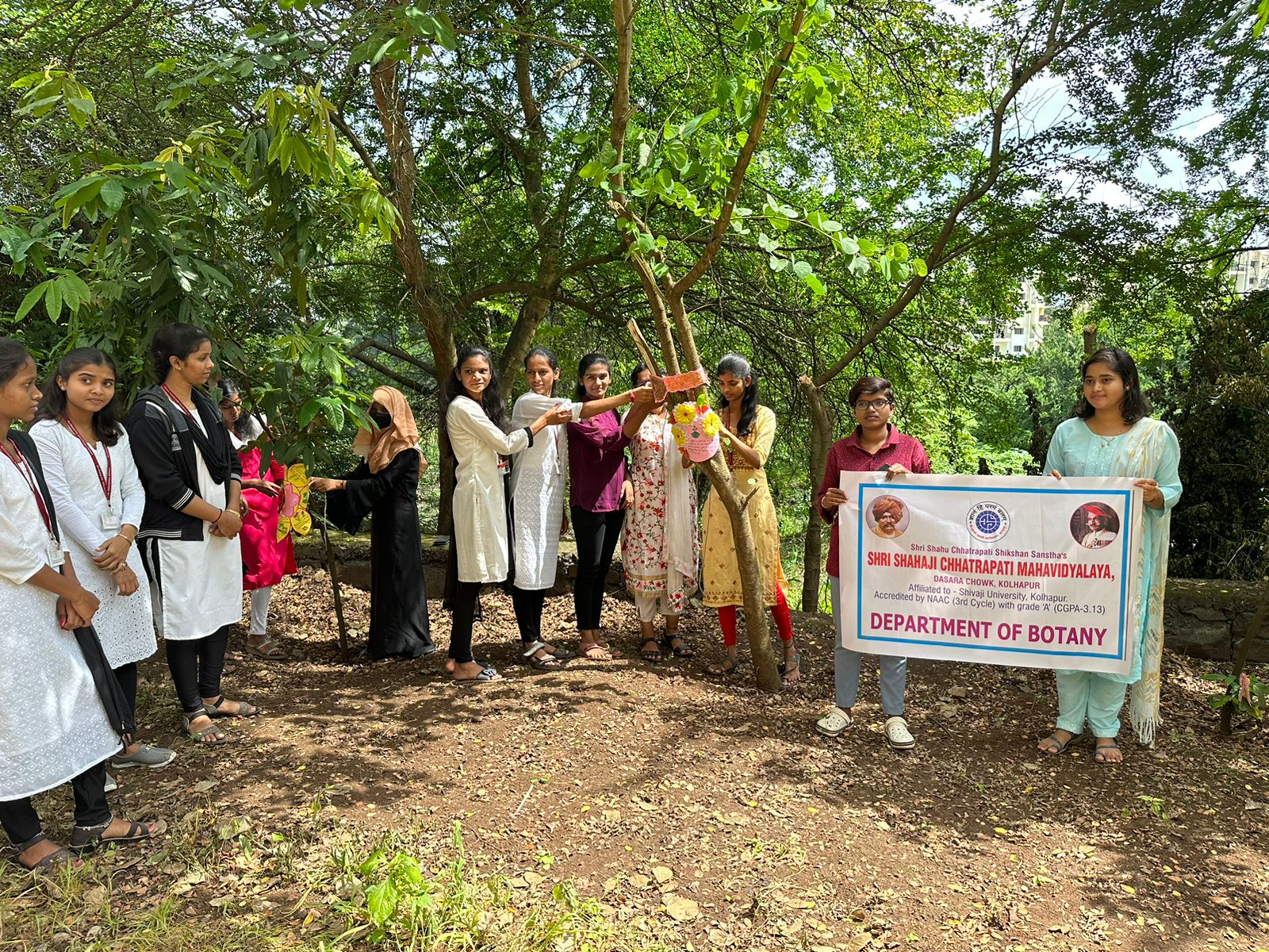 Environmentally friendly Rakshabandhan was celebrated by tying rakhis to trees in Shahaji College