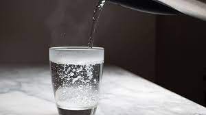 What is the benefit of drinking hot water during monsoon