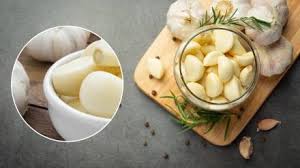 Eat a clove of garlic in the morning on an empty stomach