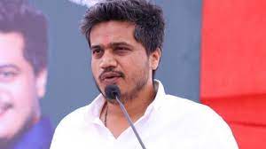 Rohit Pawar protested outside the Vidhan Bhavan in the rain